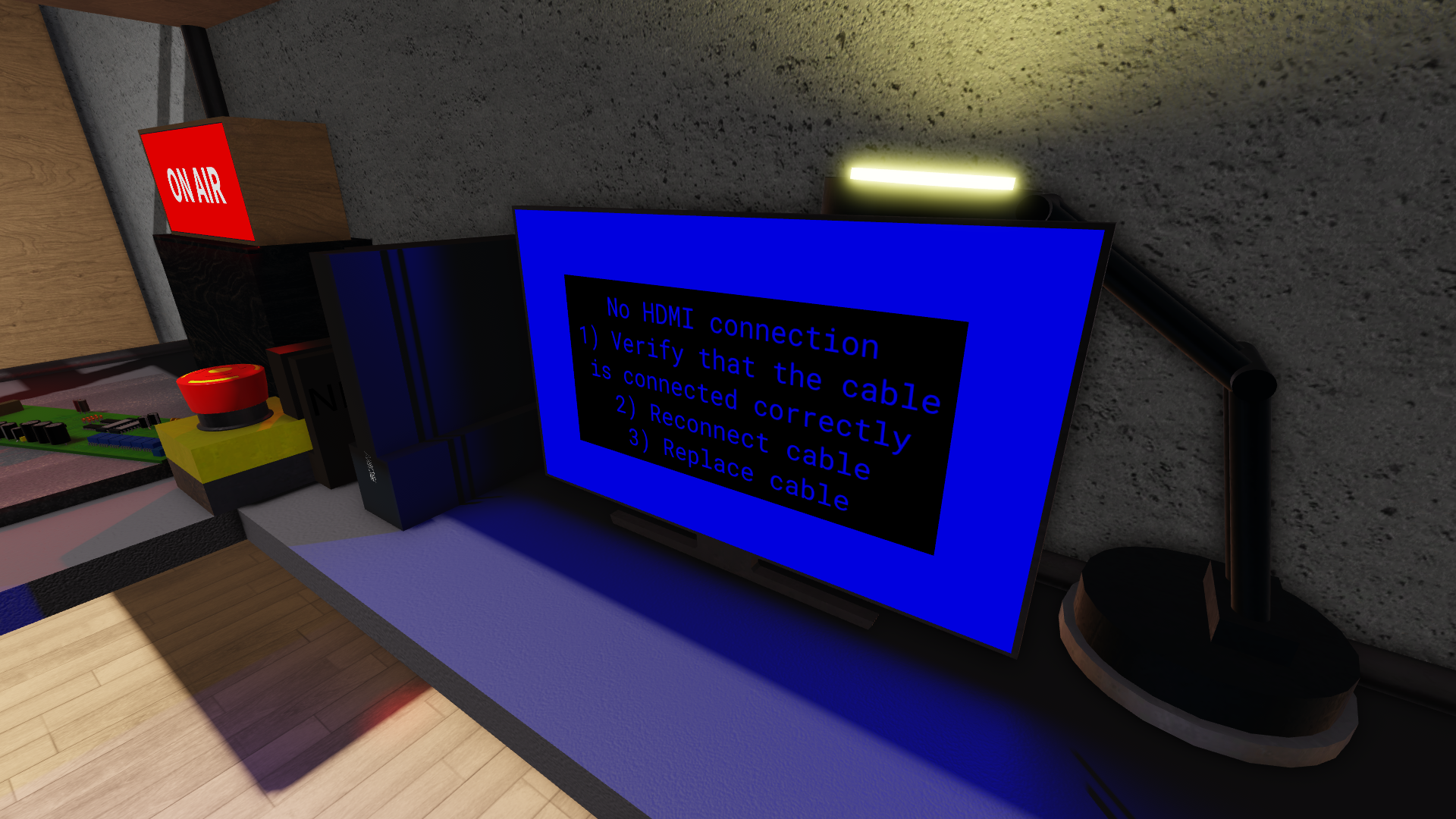 A monitor with a blue screen with the word 'No HDMI connection'. Around it are an emergency stop buttons, an on-air sign and a circuit board.