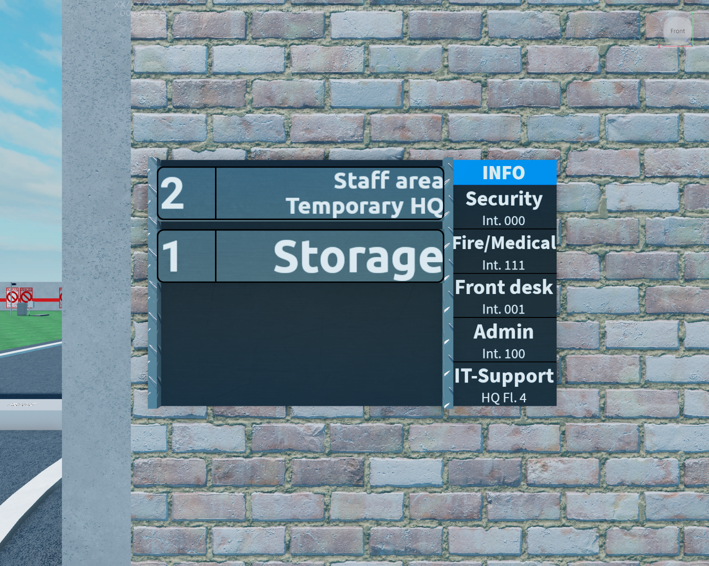 A directory sign with floor numbers and company phone numbers