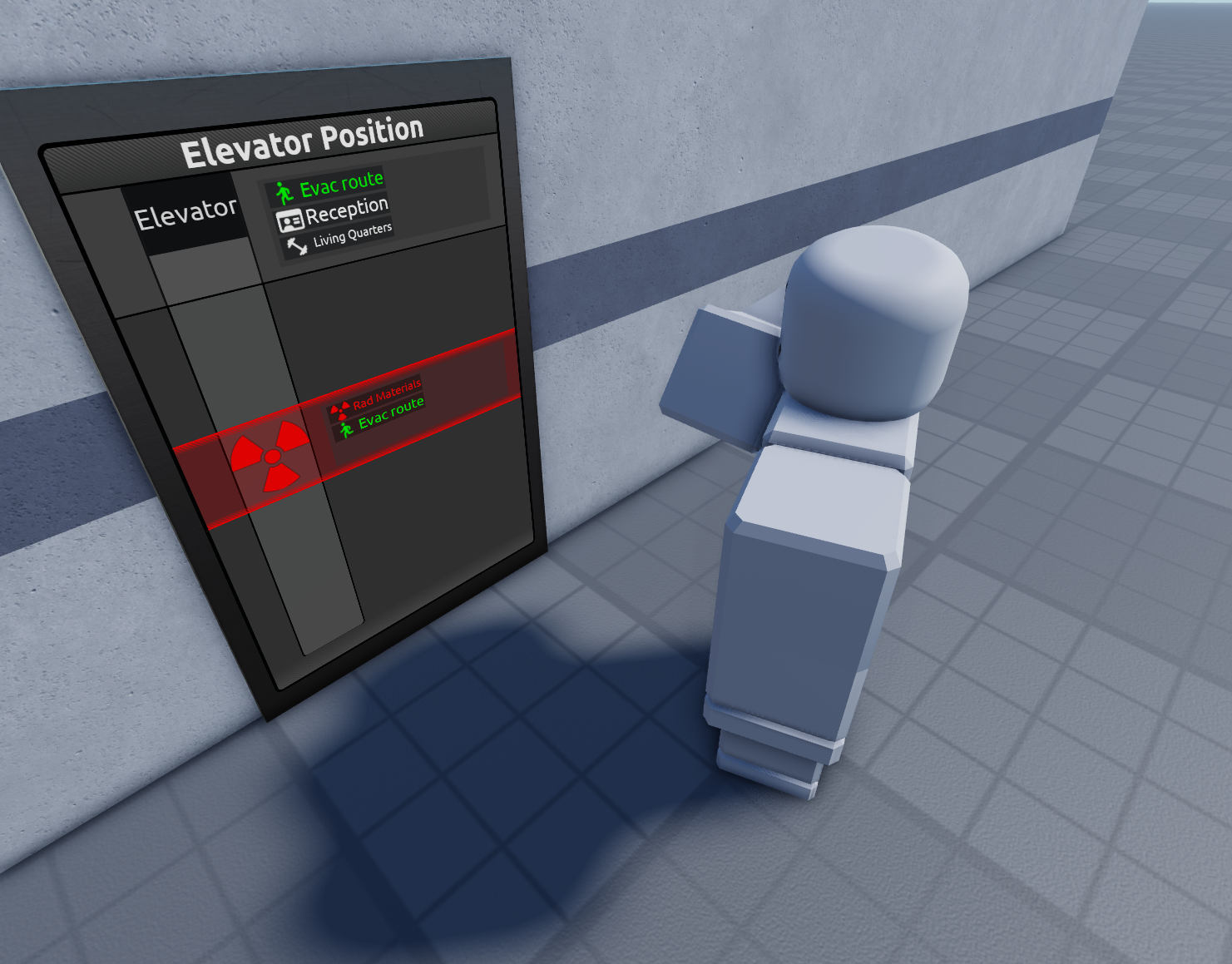 A tall monitor showing the current position of the elevator. There are 2 floors marked to be evacuation routes. The lower also marked to have radioactive materials with a big radiation symbol and red background