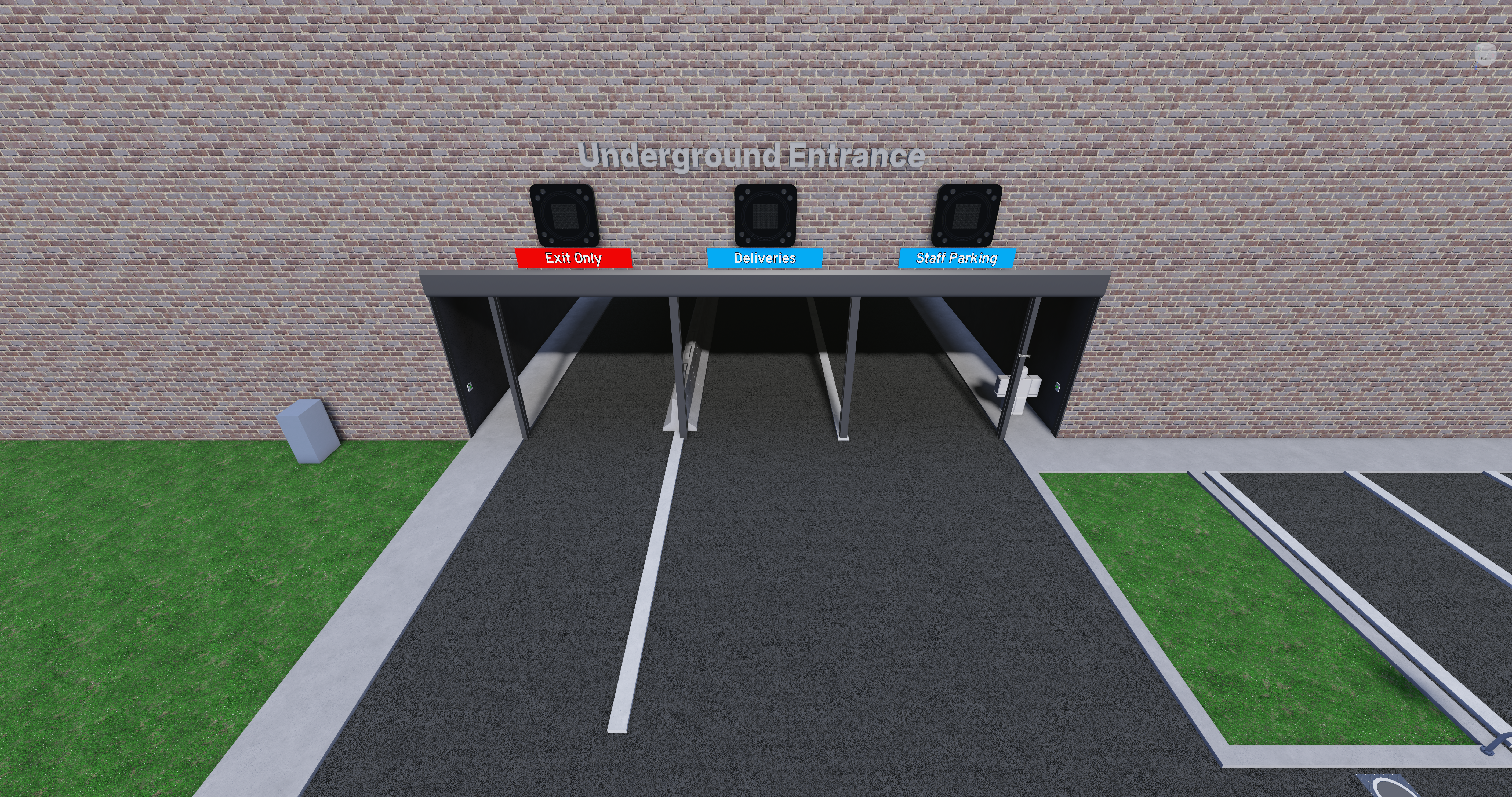 A 3-lane road to a entrance on the side of a building